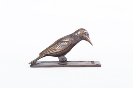 Tocapuerta de bronce pájaro